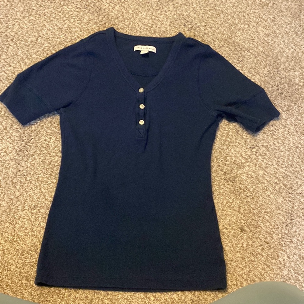 A navy blue free assembly half button up shirt with medium sleeves